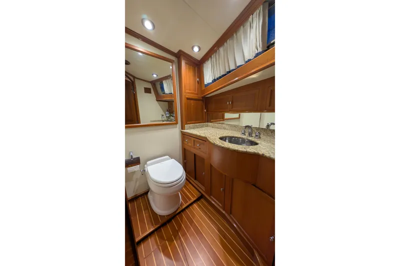 Slide: The Image of Luxurious 2004 Grand Banks 58 Eastbay FB yacht bathroom with wood accents and granite countertop. - 7