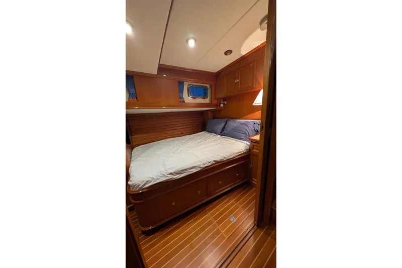 Slide: The Image of Luxurious cabin interior of 2004 Grand Banks 58 Eastbay FB yacht with wooden finishes. - 9