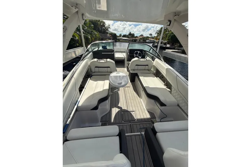 Slide: The Image of 2023 Regal LX6 boat interior with luxurious seating and sleek design. - 5