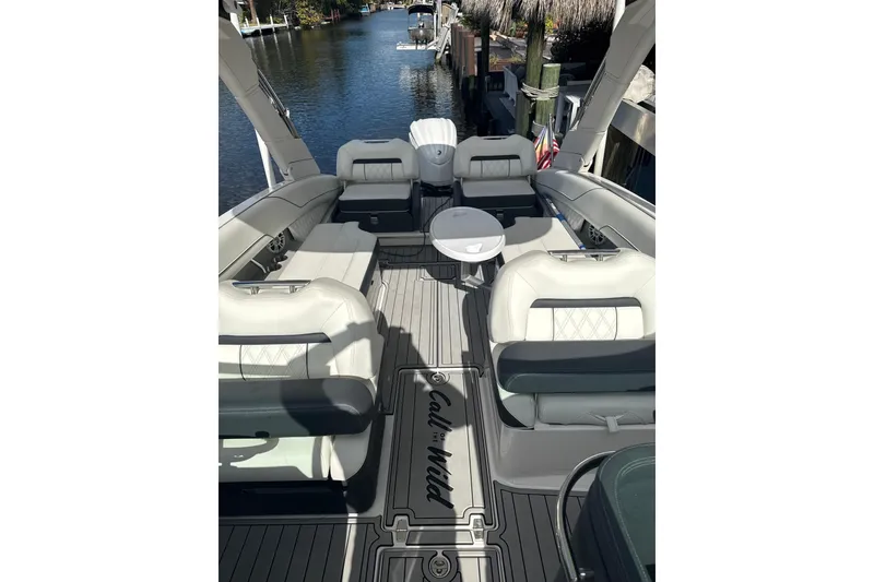 Slide: The Image of 2023 Regal LX6 boat interior with luxurious seating and sleek design. - 7
