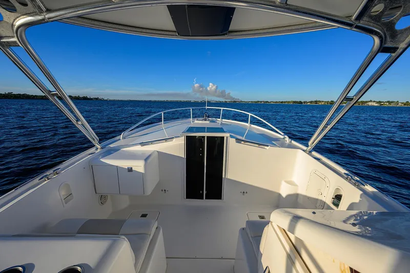 Slide: The Image of 1998 Aura 28 Tournament Series boat on open water under clear blue sky. - 10