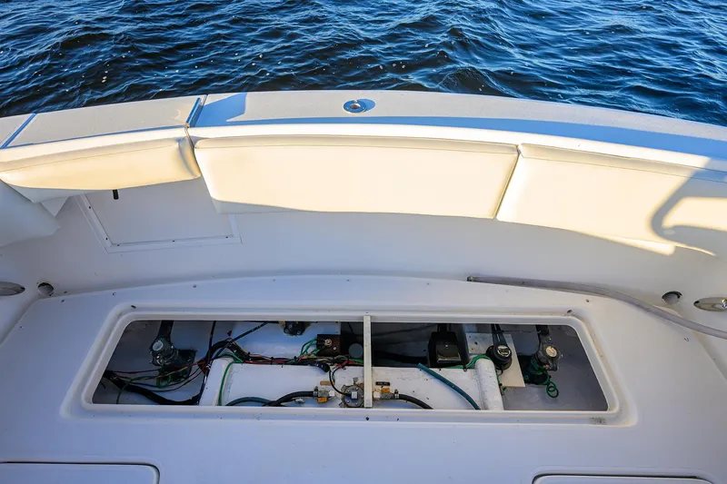 Slide: The Image of 1998 Aura 28 Tournament Series boat deck with open hatch, revealing internal components. - 22