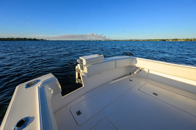 Slide: The Image of 1998 Aura 28 Tournament Series boat on calm blue water under clear sky. - 23