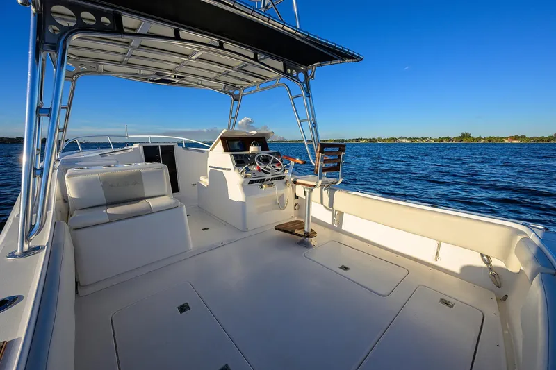 Slide: The Image of 1998 Aura 28 Tournament Series boat interior with helm, seating, and ocean view. - 26