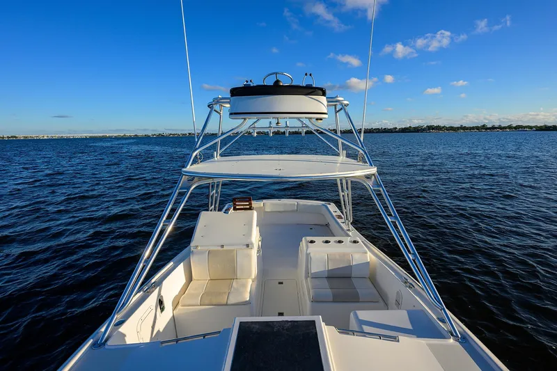 Slide: The Image of 1998 Aura 28 Tournament Series boat on open water under clear blue sky. - 35