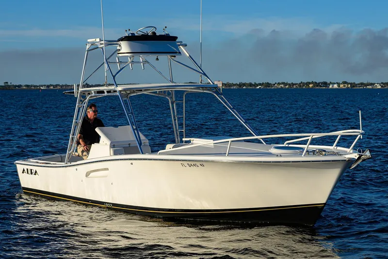 Slide: The Image of 1998 Aura 28 Tournament Series boat cruising on open water. - 41