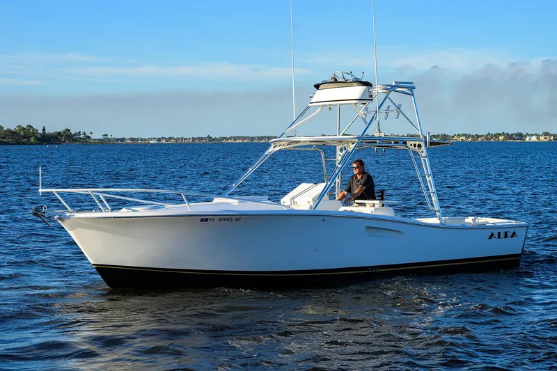 Slide: The Image of 1998 Aura 28 Tournament Series boat cruising on a sunny day. - 44