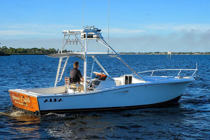 Slide: The Image of 1998 Aura 28 Tournament Series boat cruising on a sunny day. - 47