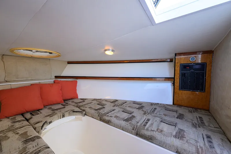 Slide: The Image of Interior cabin of 1998 Aura 28 Tournament Series boat with cushions and control panel. - 8