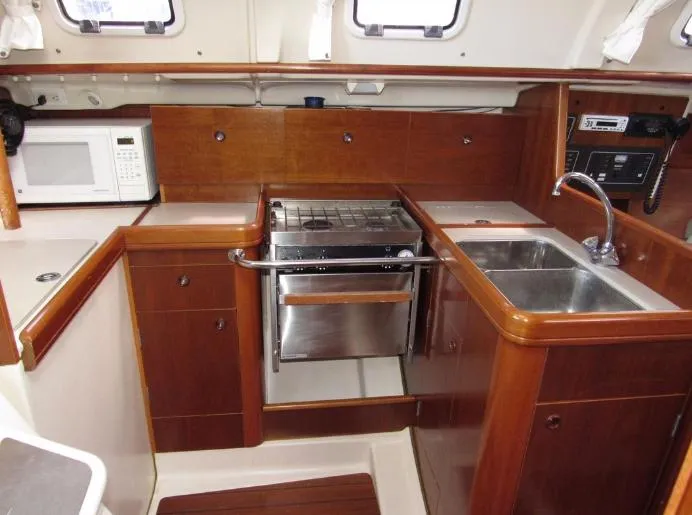 Slide: The Image of Interior of 1999 Beneteau Oceanis 321 yacht kitchen. - 14