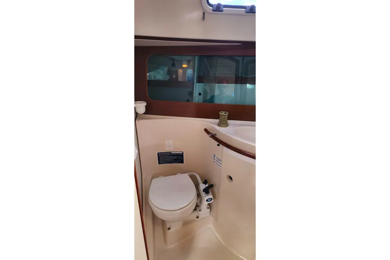 Slide: The Image of Interior of 1999 Beneteau Oceanis 321 yacht bathroom with toilet and sink. - 26