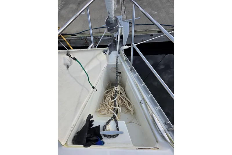 Slide: The Image of Anchor locker of a 1999 Beneteau Oceanis 321 sailboat with rope and chain. - 7