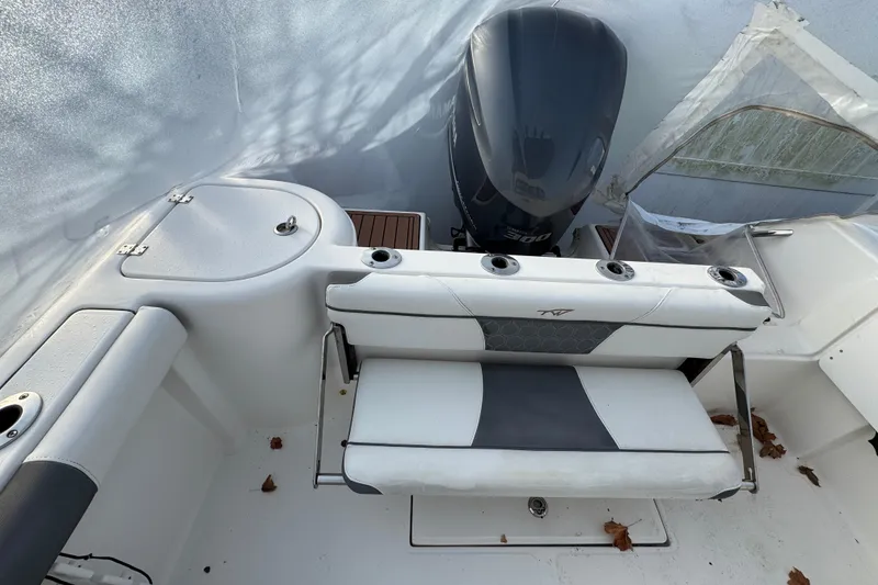 Slide: The Image of 2017 Tidewater 230 CC Adventure boat interior with seating and Yamaha 300 outboard motor. - 17