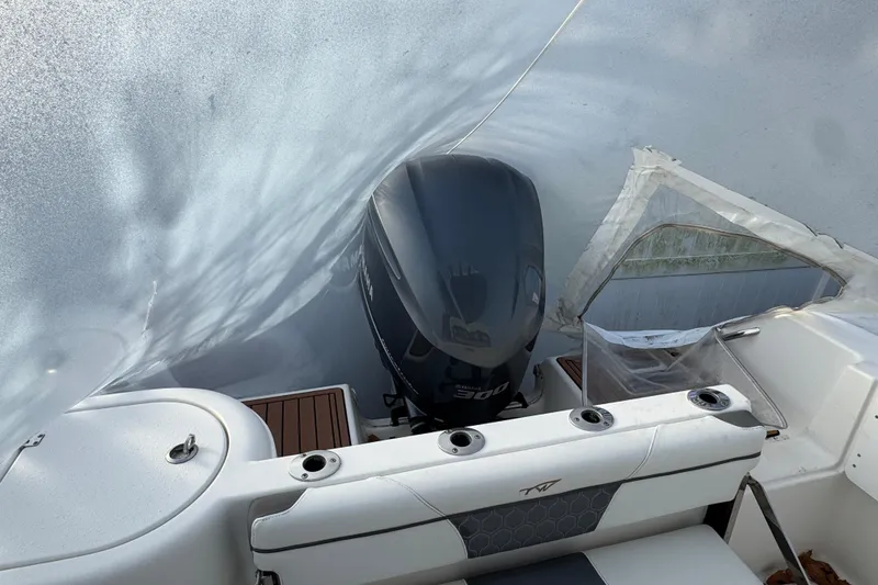 Slide: The Image of 2017 Tidewater 230 CC Adventure boat with Yamaha 300 engine, covered in protective wrap. - 21