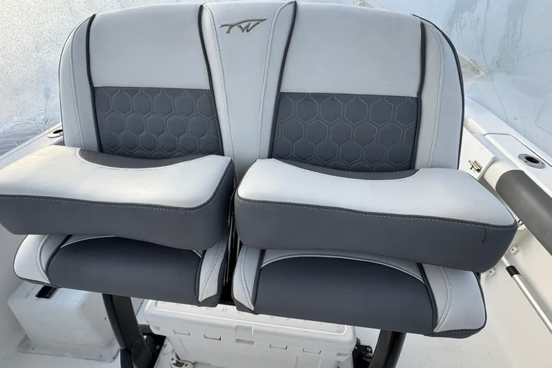 Slide: The Image of 2017 Tidewater 230 CC Adventure boat seats with gray and black upholstery. - 3
