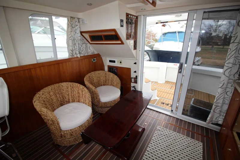 Slide: The Image of 2002 Mainship 390 Trawler bathroom with shower, sink, and toilet. - 32