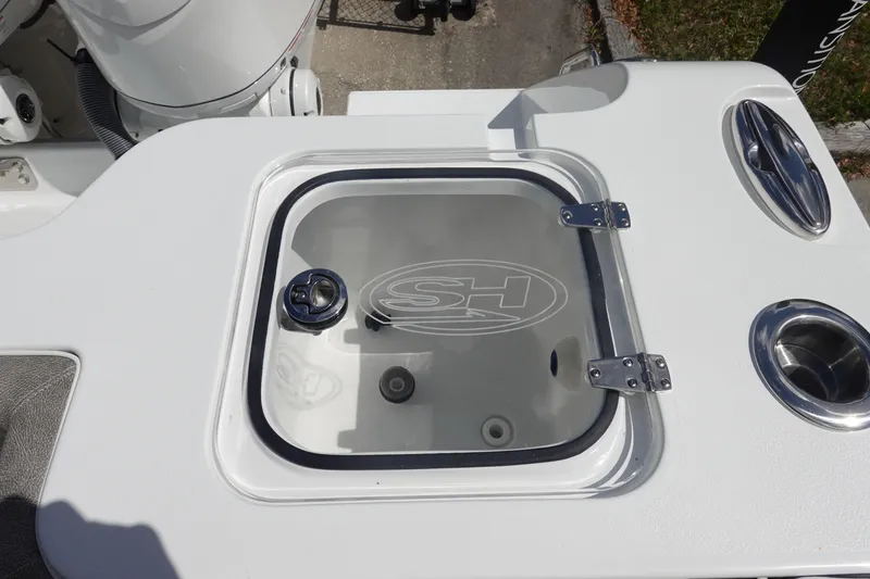 Slide: The Image of 2026 Sea Hunt Gamefish 28 Forward Seating boat detail with livewell and cup holders. - 10