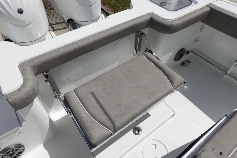 Slide: The Image of 2026 Sea Hunt Gamefish 28 Forward Seating with gray cushioned bench and dual engines. - 13