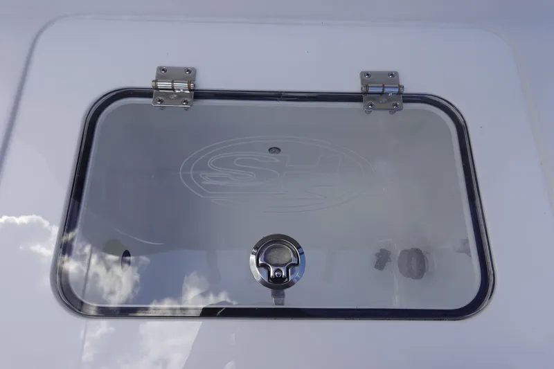 Slide: The Image of Hinged compartment on 2026 Sea Hunt Gamefish 28 Forward Seating boat. - 16