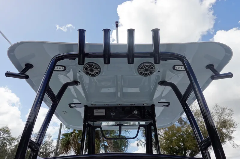 Slide: The Image of 2026 Sea Hunt Gamefish 28 boat's T-top with rod holders and speakers. - 17