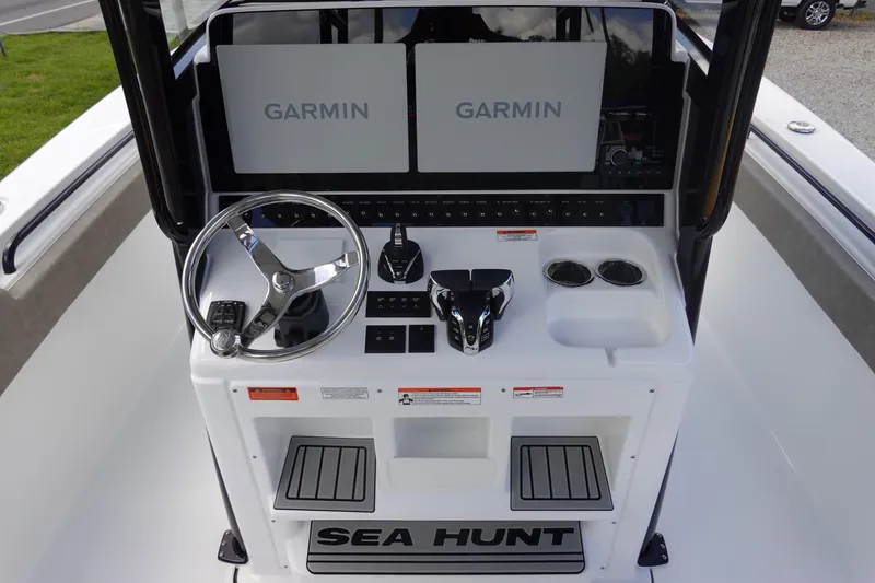 Slide: The Image of 2026 Sea Hunt Gamefish 28 helm with dual Garmin displays and modern controls. - 20