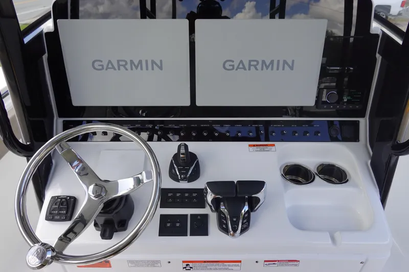 Slide: The Image of 2026 Sea Hunt Gamefish 28 console with dual Garmin displays and modern controls. - 21