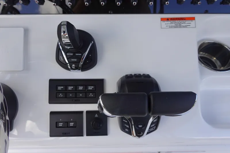 Slide: The Image of 2026 Sea Hunt Gamefish 28 control panel with advanced navigation and throttle controls. - 22