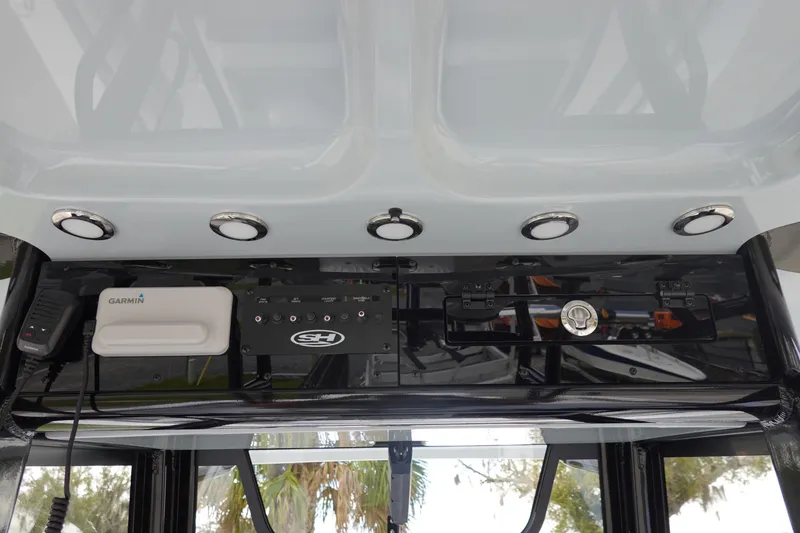 Slide: The Image of 2026 Sea Hunt Gamefish 28 console with Garmin electronics and control panel. - 23