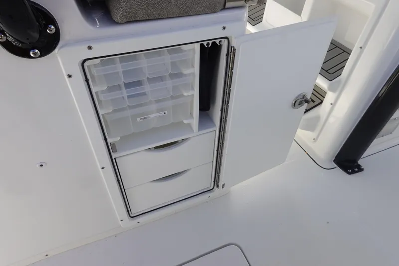 Slide: The Image of Storage compartment on 2026 Sea Hunt Gamefish 28 Forward Seating boat. - 26