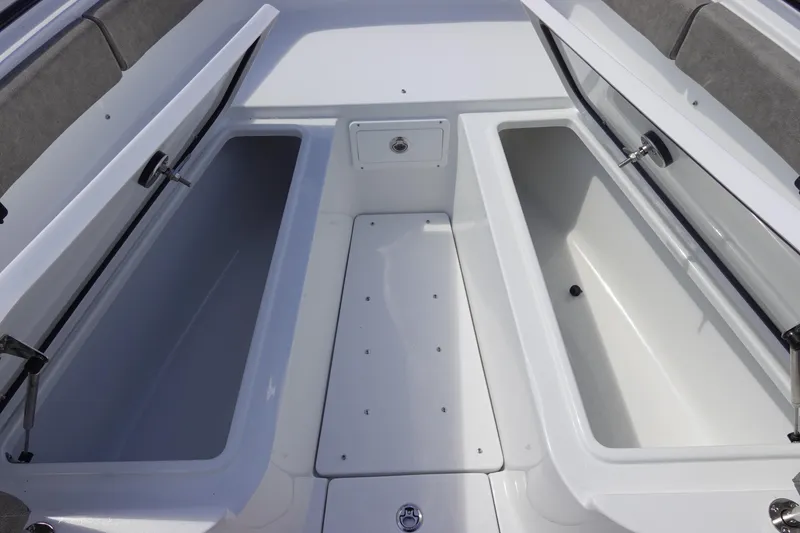 Slide: The Image of 2026 Sea Hunt Gamefish 28 Forward Seating storage compartments open, showcasing spacious design. - 34