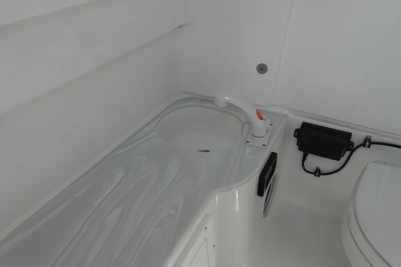 Slide: The Image of Interior of 2026 Sea Hunt Gamefish 28, featuring a sleek sink and faucet setup. - 42