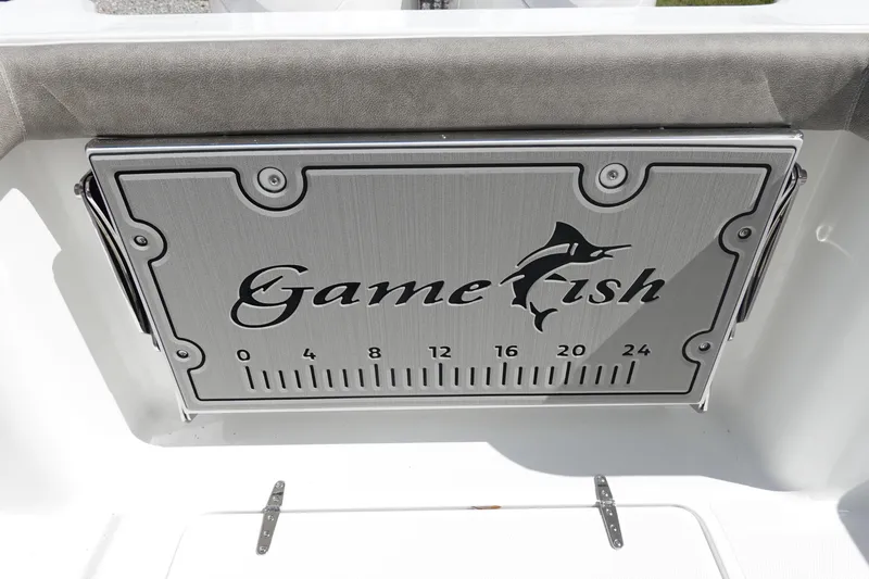 Slide: The Image of 2026 Sea Hunt Gamefish 28 Forward Seating boat detail with logo and measurement scale. - 9