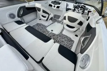 Slide: The Image of 2022 Tahoe 200 S boat interior with white and black seating. - 17