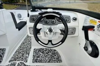 Slide: The Image of 2022 Tahoe 200 S boat dashboard with modern controls and sleek design. - 18