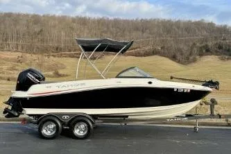 Slide: The Image of 2022 Tahoe 200 S boat dashboard with steering wheel and control panel. - 8