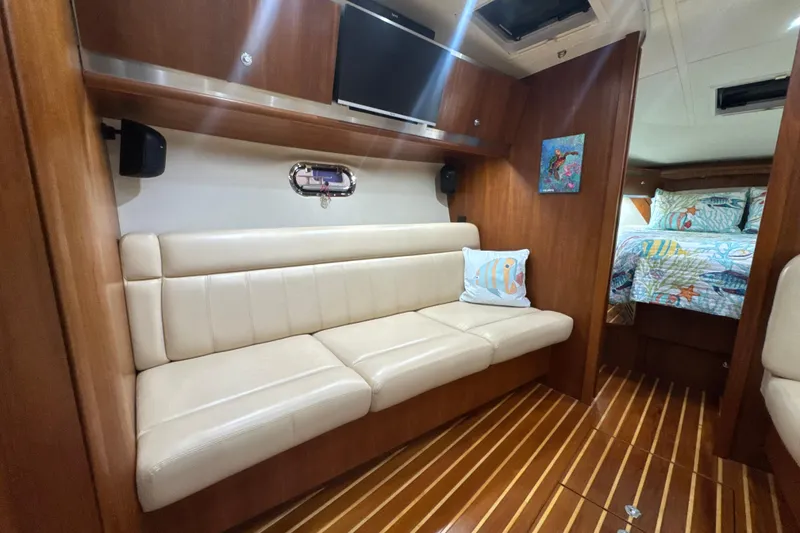 Slide: The Image of Luxurious 2006 Tiara Yachts 3600 Sovran interior with leather seating and cozy cabin. - 12
