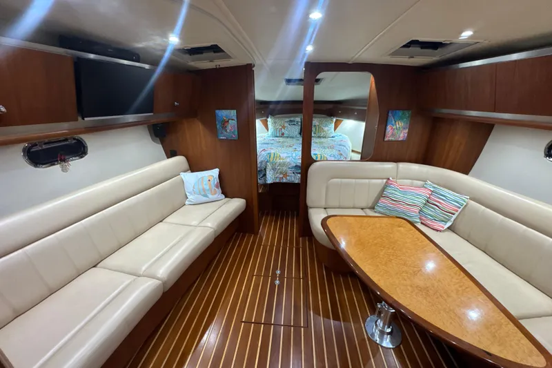 Slide: The Image of Luxurious interior of 2006 Tiara Yachts 3600 Sovran with elegant seating and wood finishes. - 16