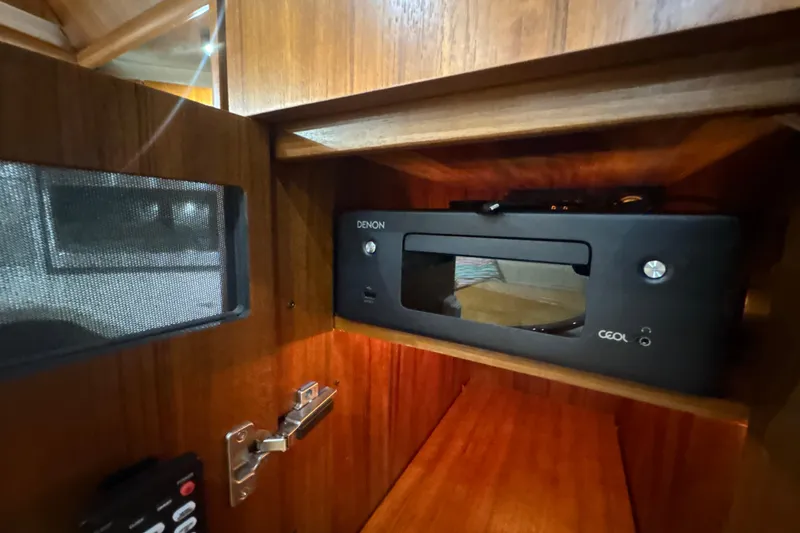 Slide: The Image of Denon audio system in 2006 Tiara Yachts 3600 Sovran's wooden cabinet interior. - 21