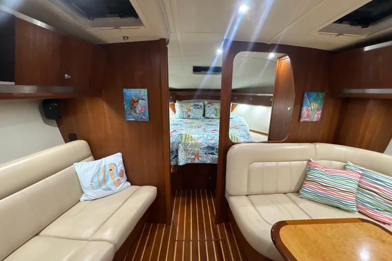 Slide: The Image of 2006 Tiara Yachts 3600 Sovran interior with cozy seating and vibrant decor. - 22