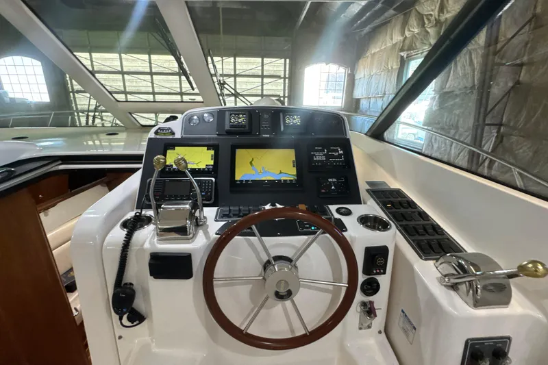 Slide: The Image of Helm of 2006 Tiara Yachts 3600 Sovran with navigation screens and controls. - 37