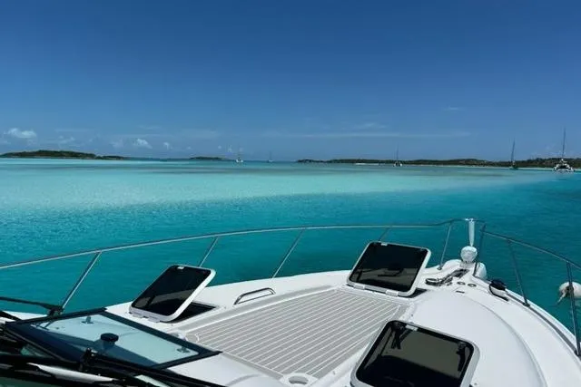 Slide: The Image of 2006 Tiara Yachts 3600 Sovran cruising on clear turquoise waters under a blue sky. - 4