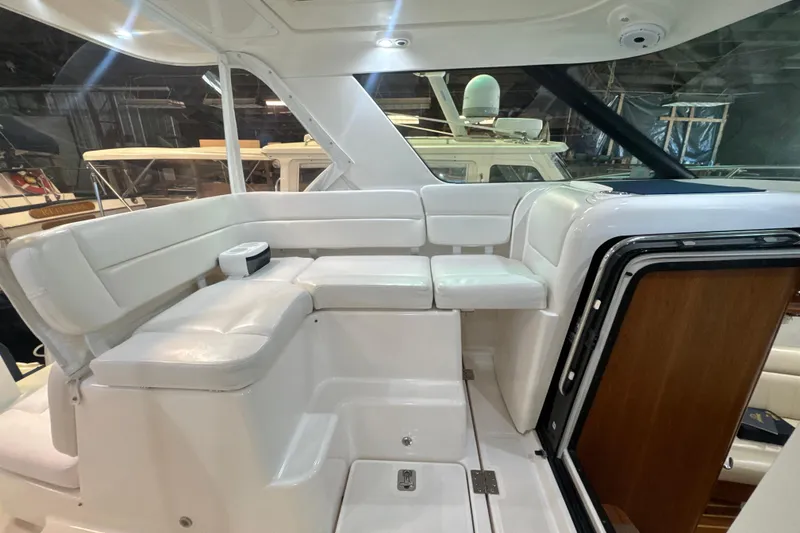 Slide: The Image of 2006 Tiara Yachts 3600 Sovran interior with white seating and wooden accents. - 46
