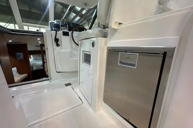 Slide: The Image of 2006 Tiara Yachts 3600 Sovran interior with helm, seating, and cabin view. - 48