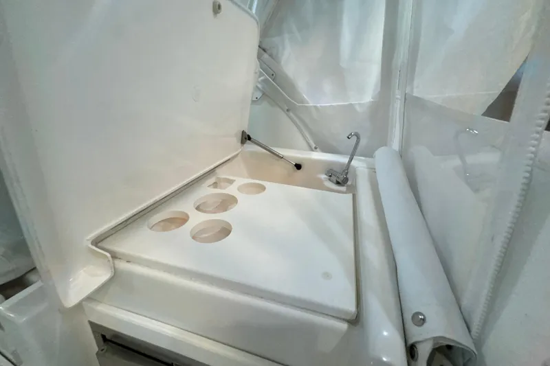 Slide: The Image of 2006 Tiara Yachts 3600 Sovran sink area with cup holders and faucet. - 50
