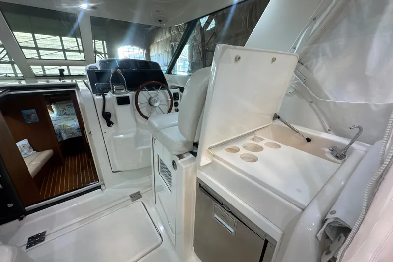 Slide: The Image of 2006 Tiara Yachts 3600 Sovran interior with helm, seating, and cabin view. - 51