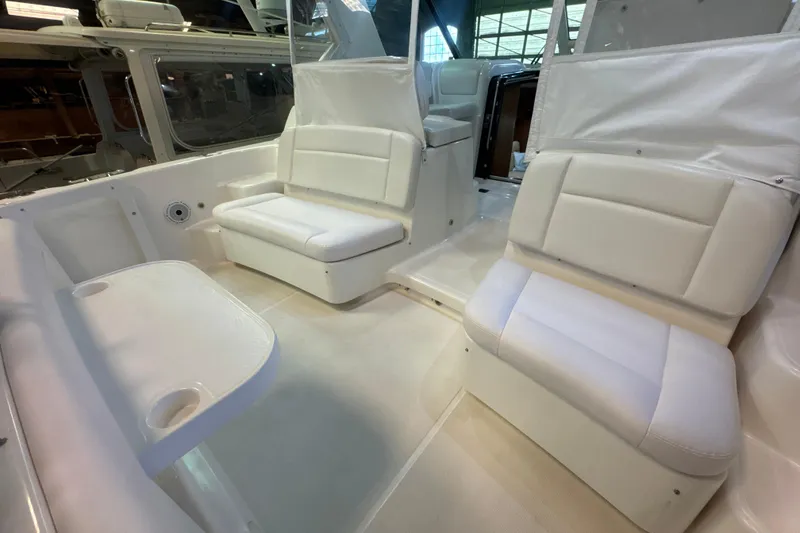 Slide: The Image of 2006 Tiara Yachts 3600 Sovran interior with white seating and table. - 56