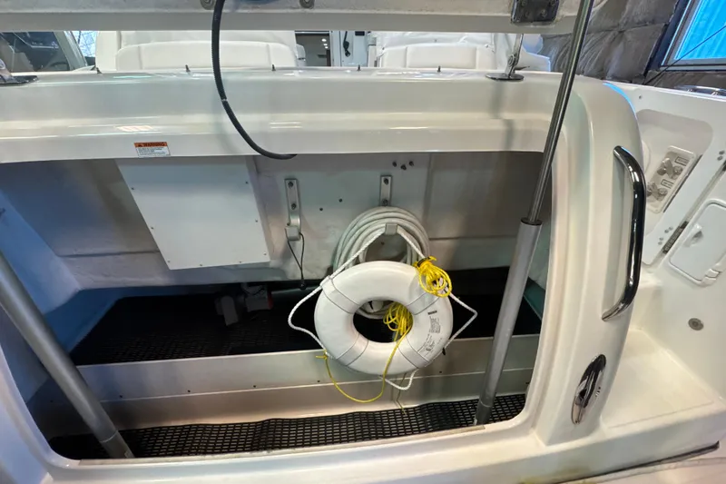 Slide: The Image of 2006 Tiara Yachts 3600 Sovran storage compartment with life ring and rope. - 57