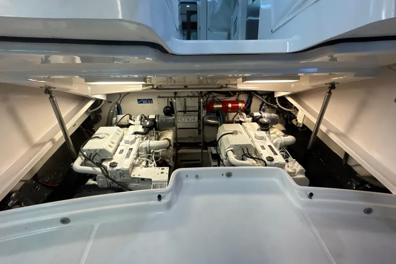 Slide: The Image of Engine compartment of 2006 Tiara Yachts 3600 Sovran, showcasing dual engines and mechanical components. - 60