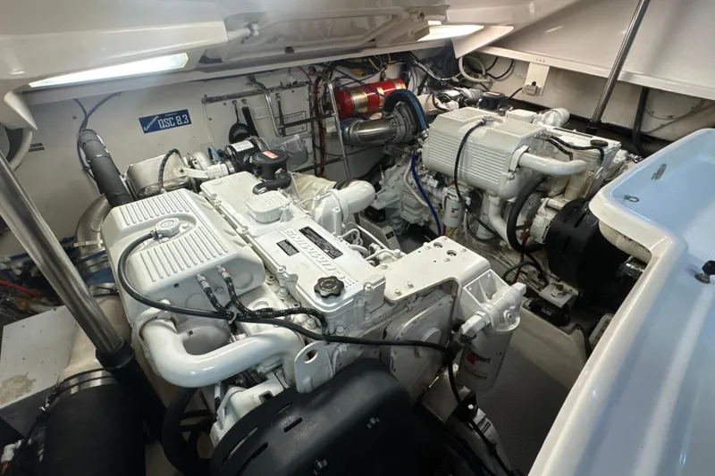 Slide: The Image of Engine room of 2006 Tiara Yachts 3600 Sovran, showcasing dual engines and mechanical components. - 63