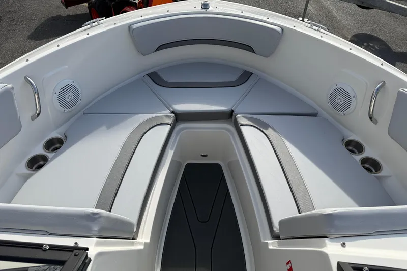 Slide: The Image of 2026 Bayliner V20 boat interior with cushioned seating and built-in speakers. - 13